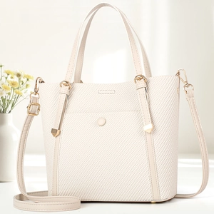 Elegant cream woven tote bag for women with adjustable strap and light gold hardware
