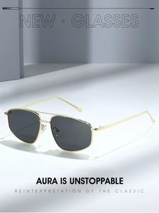 Detailed view of square metal aviator sunglasses with gold frames and gray lenses