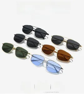 Close-up of assorted metal frame aviator sunglasses with gradient and solid lenses