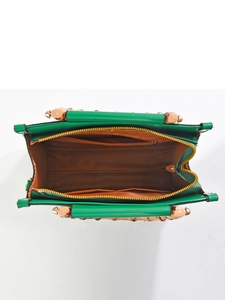 Top view of bright green handbag with bamboo handle, brown lining and internal pockets