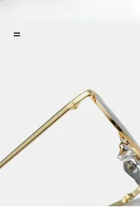 Detail shot of golden metal hinge and slim temple on lightweight fashion sunglasses