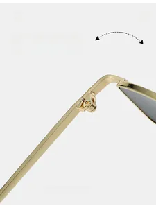 Detailed close-up of a durable golden metal hinge on fashion square sunglasses