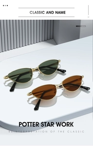 Detail of vintage cat-eye sunglasses with gold textured frames and tinted lenses
