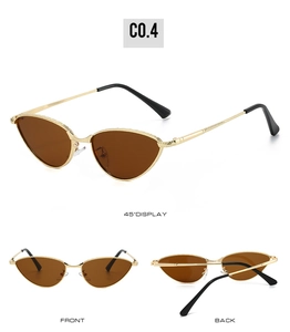 Detail view of gold cat-eye sunglasses with brown lenses and black temple tips
