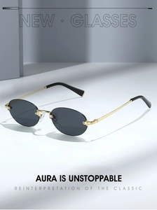 Detail view of retro rimless oval sunglasses with gold metal temples and dark lenses