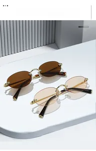 Detailed macro of rimless oval sunglasses with gold metal frame and model 8150 engraving