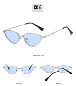 Macro view of silver metal cat-eye sunglasses with light blue lenses and engraved frames
