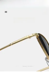 Detailed macro view of golden baroque engraved temples on vintage cat eye sunglasses