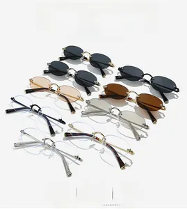 Detail view of vintage rimless oval sunglasses collection in grey, brown and clear lenses