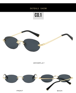 Close-up of retro rimless sunglasses with gold metal temples and dark lenses