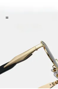 Detail of golden metal sunglasses temple with flexible hinge and black ear tips