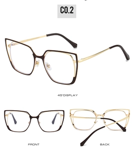 Detail view of cat eye glasses frames with gold metal temples and brown rims C0.2