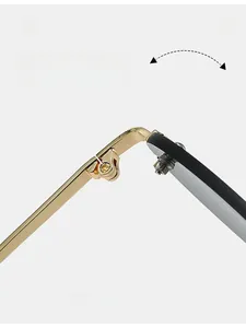 Macro view of durable gold metal hinge structure on luxury rimless sunglasses