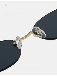Macro detail of comfortable silicone nose pads and golden metal bridge on rimless sunglasses
