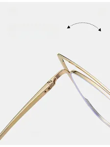 Close-up of durable metal hinge on stylish gold cat-eye glasses with polished finish
