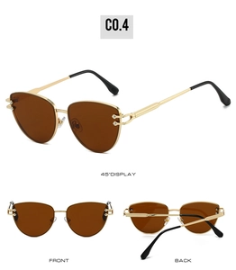 Vue en trois angles des lunettes soleil triangle dorées avec verres bruns et branches ajourées
