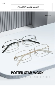 Detailed close-up of sleek metal eyewear frames in black and gold on a textured surface