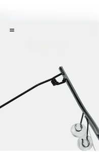 Detail of black metal glasses frame showing spring hinge and soft silicone nose pads