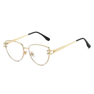 Lunettes de soleil rétro à monture métallique œil-de-chat dorée avec branches ajourées