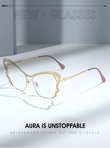 Detailed close-up of golden butterfly-shaped metal glasses frames with purple temple tips