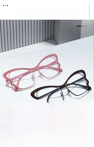 Detail of butterfly-shaped frames with wavy edges in soft pink and dark coffee colors