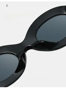 Macro shot of comfortable integrated nose pads on black oval frame sunglasses