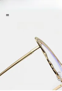 Detail of ultra-light gold butterfly metal frames with purple anti-blue light coating