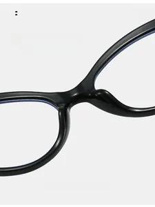 Macro view of integrated smooth black nose pads on blue light blocking glasses frame