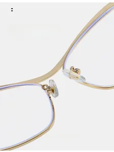 Macro detail of comfortable silicone nose pads on gold metal butterfly glasses frame