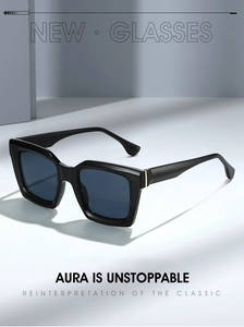 Classic black square sunglasses with deep blue lenses and gold metal details on grey background