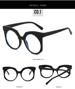 Detailed view of black cat-eye glasses frame with elegant diamond-patterned textures
