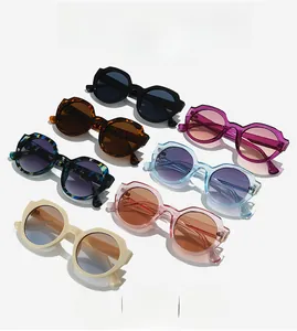 Detailed array of trendy round thick-frame sunglasses in various colors and marble patterns