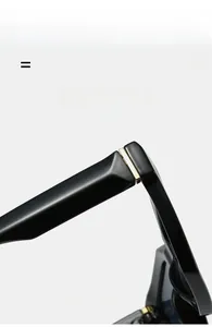 Detail of premium sunglasses hinge featuring gold metal accents and glossy black frame