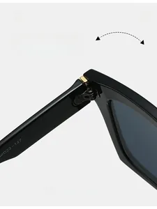Detail shot of durable metal hinge and size engraving on high-quality black sunglasses