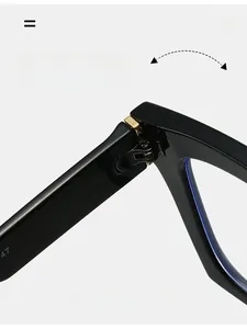 Macro shot of durable metal hinge on vintage square black frame glasses with gold accents