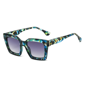 Chic oversized square sunglasses with colorful tortoiseshell frames and purple gradient lenses