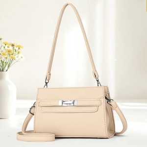 Minimalist beige pebble leather tote bag with silver buckle and floral background decoration