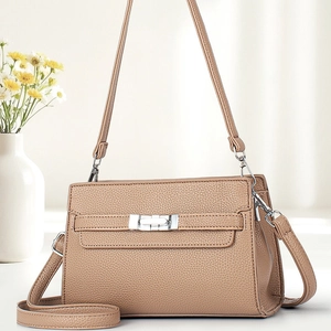Brown lychee leather crossbody bag with silver twist lock and minimalist design