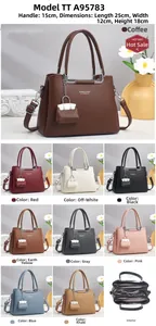 Close-up of litchi grain texture and color options for this elegant crossbody handbag