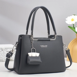 Deep grey litchi grain leather tote bag with dual handles and adjustable strap