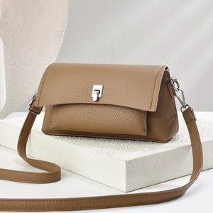 Modern brown pebbled leather square crossbody bag with silver twist lock and strap