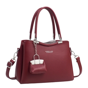 Elegant wine red leather handbag with lychee texture and silver hardware for women
