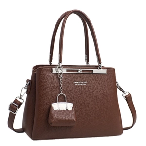 Deep brown litchi textured handbag for women with silver hardware and adjustable strap