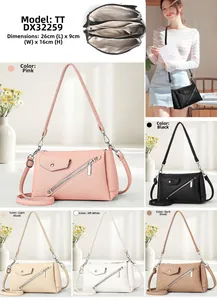 Detailed view of the crossbody bag internal compartments and 26x9x16cm dimensions