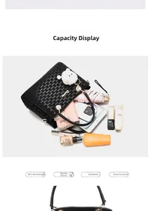Macro detail showing spacious interior of black tote bag with everyday essentials