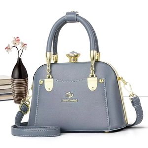 Gray blue tote bag in textured PU leather with metal handles and adjustable strap