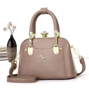 Elegant taupe leather doctor tote bag with oversized crystal clasp and gold hardware