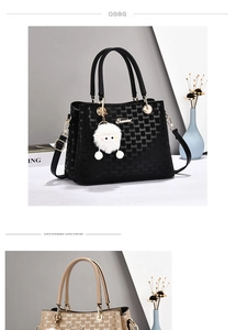 Close-up of black and khaki handbags featuring letter-textured leather and metal handles