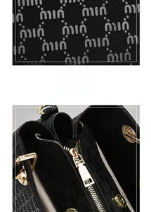 Detail of premium textured fabric and golden metal zipper on the black handbag