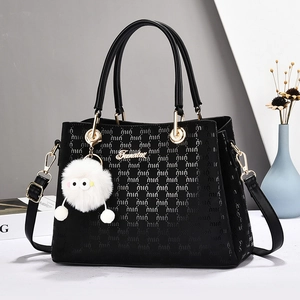 Black embossed faux leather handbag with top handles and adjustable long shoulder strap